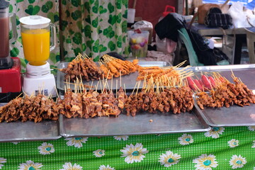 Delicious Filipino BBQ kebab meat on sticks at local market stall in Palawan, Philippines
