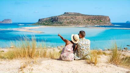 Crete Greece, Balos lagoon Crete island, Greece. Tourists relax at the crystal clear ocean of Balos...