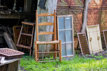 Fototapeta na wymiar outdoor barn sale with old windows and doors and furniture