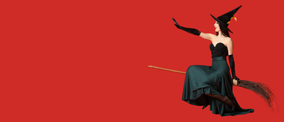 Young witch flying on broom against red background with space for text. Halloween banner