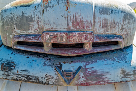 Kingston, Utah, USA - June 17, 2022: Detail of the grille and V8 logo on a 1952 Ford F4 pickup truck