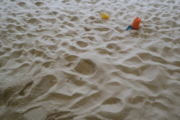child playing in the sandpit with many plastic toys design for creative and image concept.