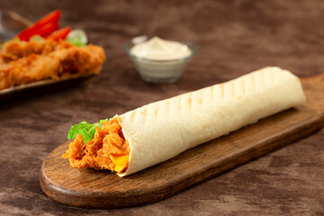  Tortilla wraps, roll with crispy chicken breast, lettuce and vegetables