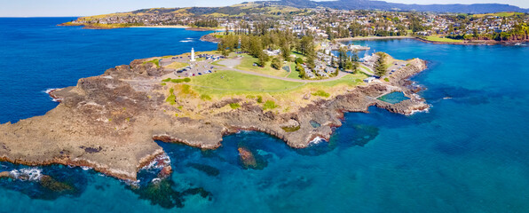 Panoramic aerial drone view at Kiama on the New South Wales South Coast, Australia showing Kiama Lighthouse on a sunny day 