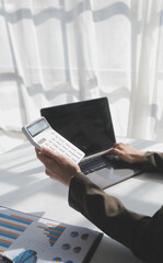 Financial Business woman analyze the graph of the company's performance to create profits and growth, Market research reports and income statistics, data,repotr,Financial and Accounting concept.