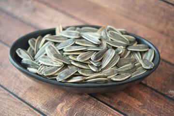 sun flower seeds in a bowl on table 