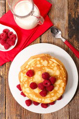 stack of pancakes with raspberries fruits