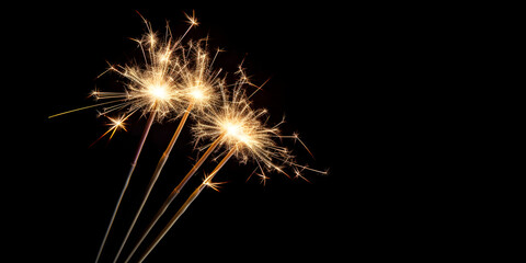 sparklers isolated on black background with copy space