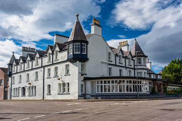 White buildings typical of the seaside village of Ullapool in Scotland, UK.