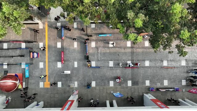 Drone view of the queue of visitors towards the entrance to the basketball court.