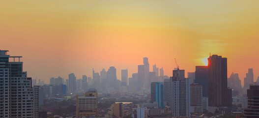 Fototapeta na wymiar The sunset sky scene in a cityscape town ,Bangkok ,Thailand.
