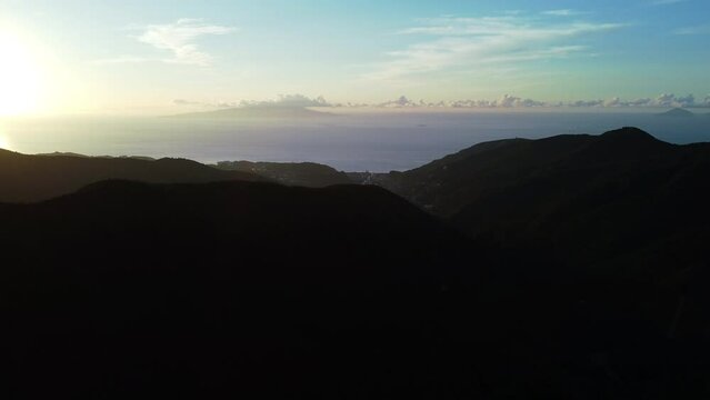 Flying over the beautiful mountain ranges at dusk in a morning