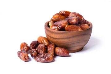 Dried date fruit in wooden bowl isolated on white background.