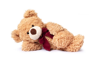 Teddy bear sleeping isolated on white background.