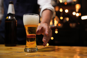 Bartender Serve beer, on wood bar, 