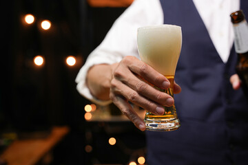 Bartender Serve beer, on wood bar, 