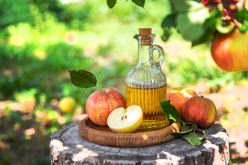 Apple cider vinegar in the garden. Selective focus.