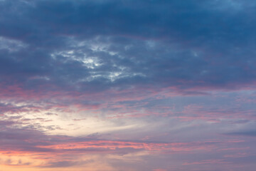 Pink blue clouds at sunset as background