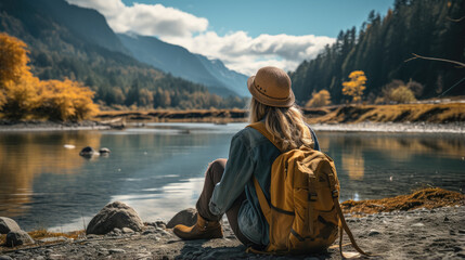 View of young woman traveler sitting , Happy woman traveler looking at mountain background , Created with Generate Ai Technology - Powered by Adobe