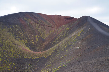 Landscape of Etna volcano, Sicily, Italy. Mountain and Hills Landscape with burned black magma.