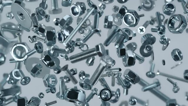 Super Slow Motion Shot of Fasteners Flying Towards Camera on Grey Background at 1000fps.