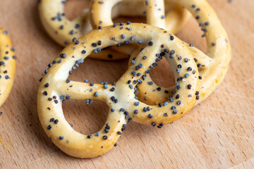 Poppy seed coating dried bagels on the table
