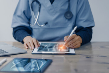 Doctor working on laptop computer with human's x-ray and medical medical network connection icons, Medical and Healthcare hospital service concept.
