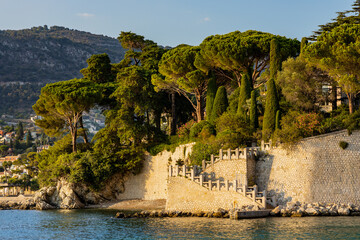 Panoramic view of Saint-Jean-Cap-Ferrat resort town on Cap Ferrat cape with exclusive estates at French Riviera of Mediterranean Sea in France