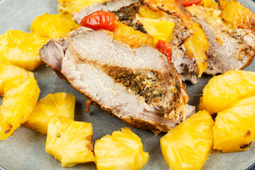 Pork meat baked with pineapple.
