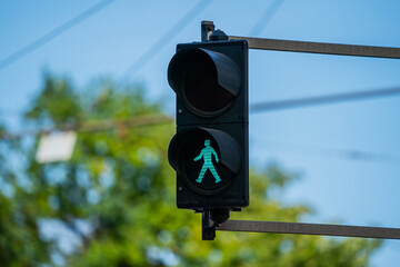 Green light for pedestrians walking in city centre in Europe