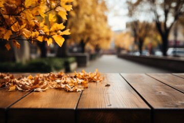 Wooden boards on the background of a blurred autumn park.