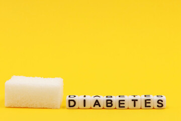 A sugar cane photographed at great increase next to the word diabetes. World Diabetes Day