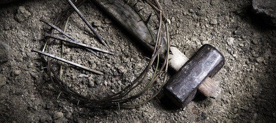Rusty nails and a wreath of thorns at the cross