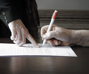 An old woman is forced to write a will for an apartment