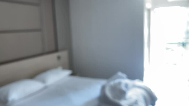 First person point of view walking in hotel room feeling dizzy interior blurry motion sunny day and falling on the bed and blacked out