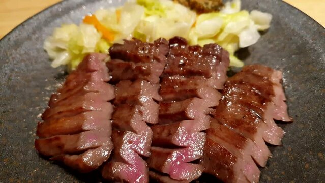 Sprcialty signature food of Japan Sendai beef tongue gyutan ox tongue meat charcoal grill
