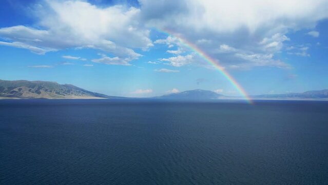 Aerial video of a rainbow over the Sayram Lake in Xinjiang, China