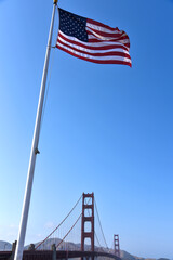 The American Flag and the Golden Gate Bridge on a Bright Summer Day - San Francisco, California