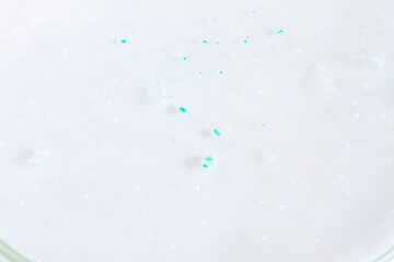 Foam with granules of blue and white color.