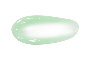 A dab of fresh light green cream or cucumber face mask. With granules and flecks. On a blank...