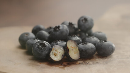 fresh blueberries on olive wood board