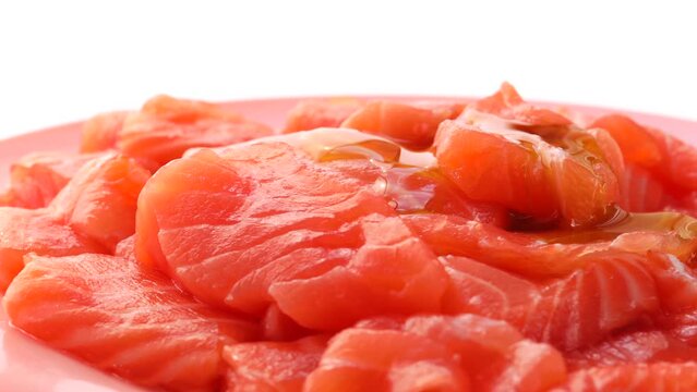 redfish slices on a white background, rotation in circle. salmon slices Turning. selective focus