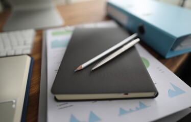 Empty business office with stationery lie on wooden table background. Workplace organization concept
