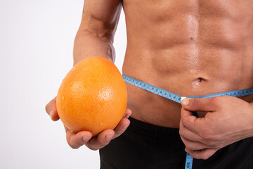 Diet, sport and healthy lifestyle. A guy with a beautiful body. Proper nutrition and sports...
