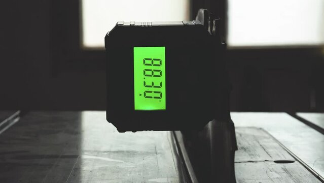 Adjusting table wood saw blade angle using a digital angle finder gauge. Magnetic Protractor Inclinometer Angle Cube Level Box used in woodworking