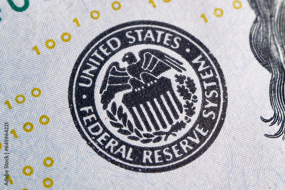 Wall mural macro photo of federal reserve system symbol one hundred dollar bill usd. close-up with fine and sha