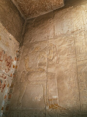 
Egyptian hieroglyph on a temple wall depicting ancient Egyptian magic with our image of a temple...