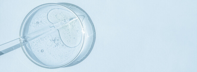 Petri dish. Petri's cup with liquid. Chemical elements, oil, cosmetics. Gel, water, molecules,...
