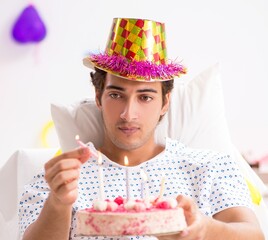 Young man celebrating his birthday in hospital