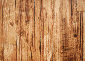 Brown wood texture background. The wood paneling has a beautiful dark pattern, the texture of hardwood floors.